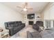 A comfortable living room featuring a fireplace, ceiling fan, and comfortable furnishings at 4710 Rollingwood Dr, Durham, NC 27713