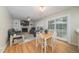 Inviting living room with a fireplace, ceiling fan, and sliding glass doors to a patio at 4710 Rollingwood Dr, Durham, NC 27713