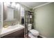 Cozy bathroom with modern fixtures, stylish shelving, and a clean, minimalist design at 4777 Helena Moriah Rd, Rougemont, NC 27572