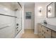 Bright bathroom featuring a shower with glass door, elegant fixtures, and modern design at 4777 Helena Moriah Rd, Rougemont, NC 27572