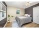 Bedroom featuring a ceiling fan, natural light, and modern decor elements at 4777 Helena Moriah Rd, Rougemont, NC 27572