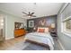 Cozy bedroom featuring a modern ceiling fan, an area rug and stylish decor at 4777 Helena Moriah Rd, Rougemont, NC 27572