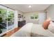 Bedroom with access to a deck featuring hardwood floors and abundant natural light at 4777 Helena Moriah Rd, Rougemont, NC 27572