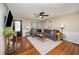 Inviting living room with hardwood floors, large sofa, and decorative rug at 4777 Helena Moriah Rd, Rougemont, NC 27572