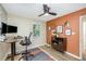 Bright home office with modern furniture, natural light, and a ceiling fan at 4777 Helena Moriah Rd, Rougemont, NC 27572