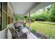 Inviting covered front porch with comfortable seating, providing a cozy outdoor space at 4777 Helena Moriah Rd, Rougemont, NC 27572
