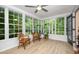 Light-filled sunroom with floor-to-ceiling windows and views of the outdoors, great for relaxing at 4777 Helena Moriah Rd, Rougemont, NC 27572