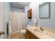 Clean bathroom featuring a shower, toilet, vanity, and medicine cabinet with a mirror at 506 E E St, Butner, NC 27509