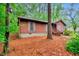 Cozy single-story home with wood siding, offering a glimpse of natural beauty and a tranquil setting at 506 E E St, Butner, NC 27509
