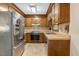 Functional kitchen featuring wood cabinets, modern appliances, and ample counter space at 506 E E St, Butner, NC 27509