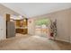 Open-concept living area with sliding glass doors, seamlessly connecting indoor and outdoor spaces at 506 E E St, Butner, NC 27509