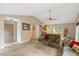 Inviting living room features vaulted ceilings, plush furnishings, and an abundance of natural light at 506 E E St, Butner, NC 27509