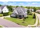 Aerial view showcasing the property's landscaping, street, and neighborhood at 5100 Schellinger, Raleigh, NC 27612