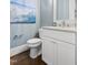 Charming powder room with a stylish vanity, elegant fixtures, and soothing wall color at 5100 Schellinger, Raleigh, NC 27612