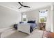 This bedroom features a white bed frame, neutral carpeting, and bright natural light at 5100 Schellinger, Raleigh, NC 27612
