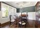 Spacious dining room with large windows and elegant wooden furniture at 5100 Schellinger, Raleigh, NC 27612