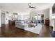 Open-concept living room with a cozy seating area and clear views of the kitchen and patio at 5100 Schellinger, Raleigh, NC 27612