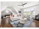 Bright living room features vaulted ceiling, hardwood floors, and accent rug at 5100 Schellinger, Raleigh, NC 27612