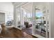 Screened in porch with wicker seating, ceiling fan, wood flooring, and a view to the outside at 5100 Schellinger, Raleigh, NC 27612
