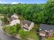 Aerial view showcasing a home with mature trees and a spacious backyard at 552 Stobhill Ln, Holly Springs, NC 27540