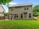 The back exterior has an outdoor patio with a pergola and a lawn at 552 Stobhill Ln, Holly Springs, NC 27540