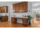 Convenient desk area with built-in cabinets and drawers in a light and open kitchen at 552 Stobhill Ln, Holly Springs, NC 27540