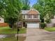 Charming two-story home with stone accents and a well-manicured lawn at 552 Stobhill Ln, Holly Springs, NC 27540