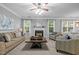 Bright living room with a fireplace, neutral tones, and lots of natural light at 552 Stobhill Ln, Holly Springs, NC 27540