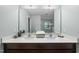 Bathroom with double sinks, a large mirror and a clean, neutral color scheme at 60 Silent Brook Trl, Franklinton, NC 27525