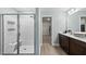 Bathroom with a tiled shower, double vanity and a walk-in closet at 60 Silent Brook Trl, Franklinton, NC 27525