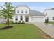 Charming two-story home with a well-manicured lawn and inviting front porch at 60 Silent Brook Trl, Franklinton, NC 27525