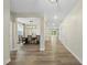 Inviting hallway with wood flooring leading to the dining area and backyard at 60 Silent Brook Trl, Franklinton, NC 27525