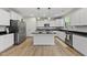 Modern kitchen with white cabinets, granite countertops and stainless steel appliances at 60 Silent Brook Trl, Franklinton, NC 27525