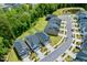 Aerial shot of modern homes located in a neighborhood with a pond and green trees at 6036 Balance Ct, Raleigh, NC 27616