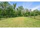 Expansive backyard with lush green grass and black fence at 6036 Balance Ct, Raleigh, NC 27616