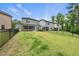 Wide backyard with a fenced perimeter and screened-in patio at 6036 Balance Ct, Raleigh, NC 27616