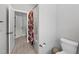 Bathroom featuring a toilet, tiled floor, and floral shower curtain at 6036 Balance Ct, Raleigh, NC 27616