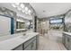 Stylish bathroom features gray wallpaper, dual vanities, walk-in shower, a large soaking tub, and modern fixtures at 6036 Balance Ct, Raleigh, NC 27616