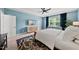 Cozy bedroom features blue walls, stylish furniture, large window, and modern decor for a relaxing retreat at 6036 Balance Ct, Raleigh, NC 27616