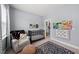 Bedroom featuring a crib, comfortable chair, and colorful decor at 6036 Balance Ct, Raleigh, NC 27616