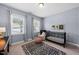 Stylish Bedroom with large windows, crib, and area rug at 6036 Balance Ct, Raleigh, NC 27616