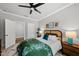 Bright bedroom featuring a large window, stylish furniture, and modern decor for a relaxing retreat at 6036 Balance Ct, Raleigh, NC 27616