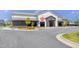 Building with dark gray and white exterior paint, a gray metal roof, and outdoor seating at 6036 Balance Ct, Raleigh, NC 27616