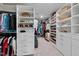 Spacious walk-in closet features built-in shelving and ample storage for clothes and accessories at 6036 Balance Ct, Raleigh, NC 27616