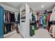 Bright walk-in closet has organized shelving and plenty of space for storage of clothing and accessories at 6036 Balance Ct, Raleigh, NC 27616