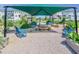 Community garden with shaded picnic tables surrounded by raised garden beds at 6036 Balance Ct, Raleigh, NC 27616