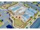 Aerial view of community pool with lounge chairs and a playground with lush greenery at 6036 Balance Ct, Raleigh, NC 27616