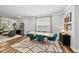Dining room featuring modern light fixture, seating for six, and hardwood floors at 6036 Balance Ct, Raleigh, NC 27616