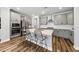 Modern kitchen with stainless steel appliances, quartz countertops, and a spacious island with seating at 6036 Balance Ct, Raleigh, NC 27616