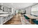 Open-concept living space with a seamless transition from the kitchen island to the living room and dining area at 6036 Balance Ct, Raleigh, NC 27616